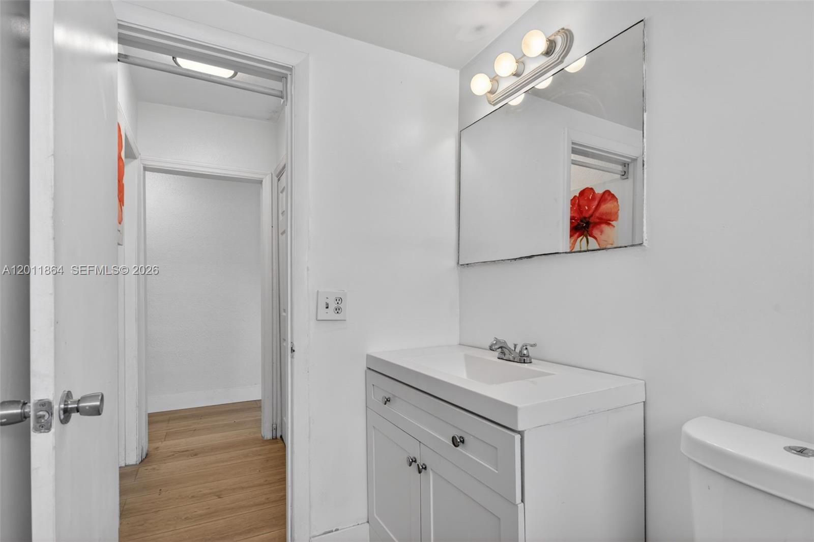 615 South Riverside Drive, Unit 5 Pompano Beach, FL 33062 - Photo 20 of 29 a bathroom with a sink vanity and a mirror