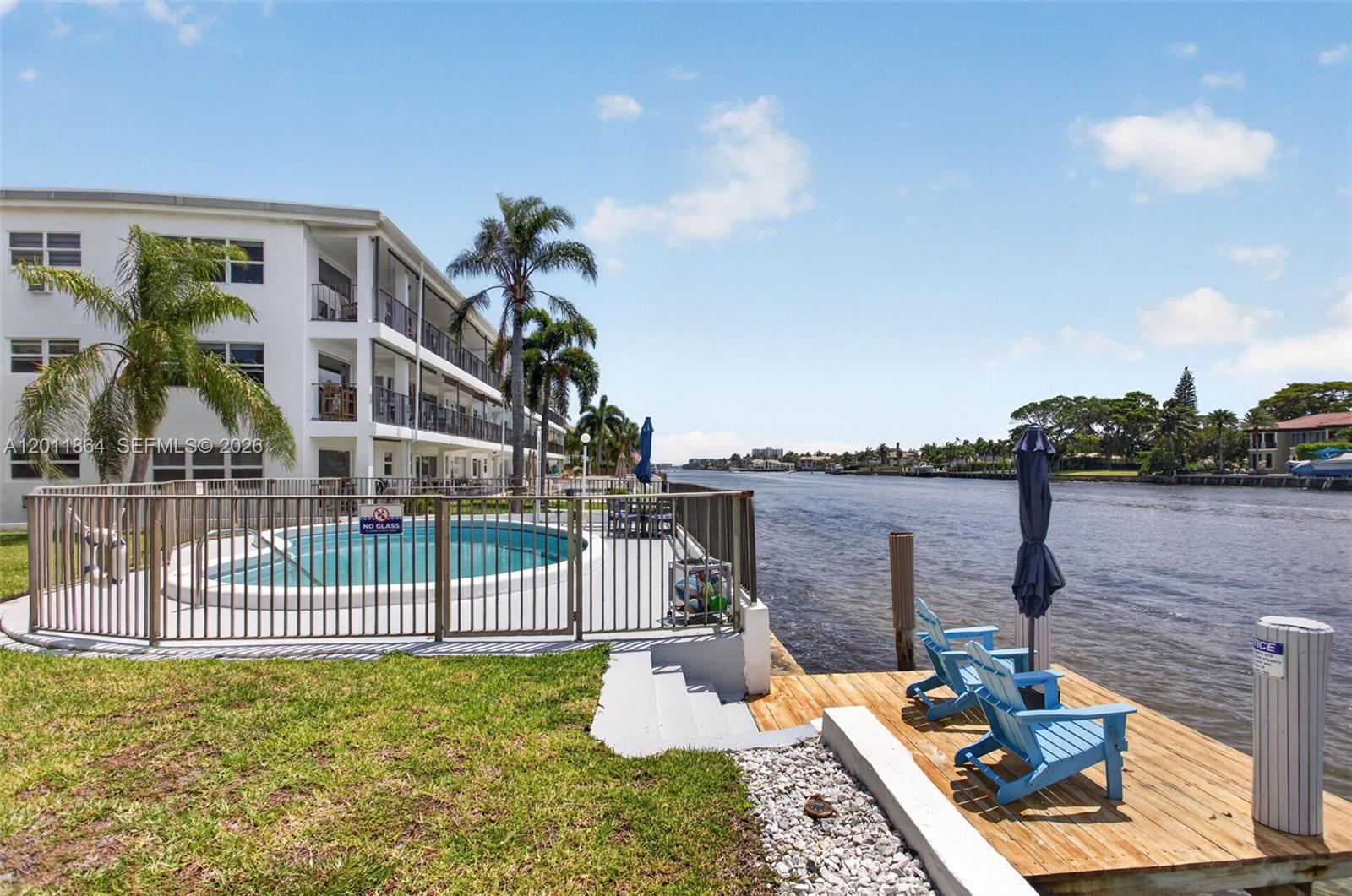 615 South Riverside Drive, Unit 5 Pompano Beach, FL 33062 - Photo 21 of 29 a balcony with furniture and a garden