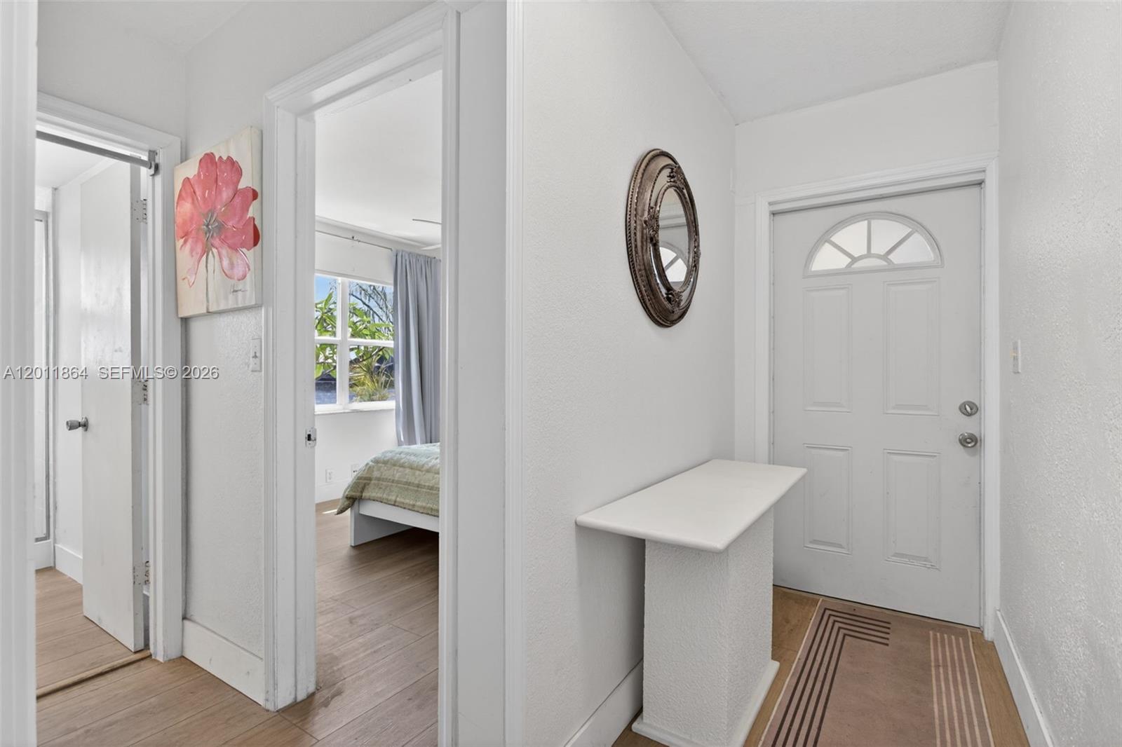 615 South Riverside Drive, Unit 5 Pompano Beach, FL 33062 - Photo 4 of 29 a view of a hallway with elevator and mirror