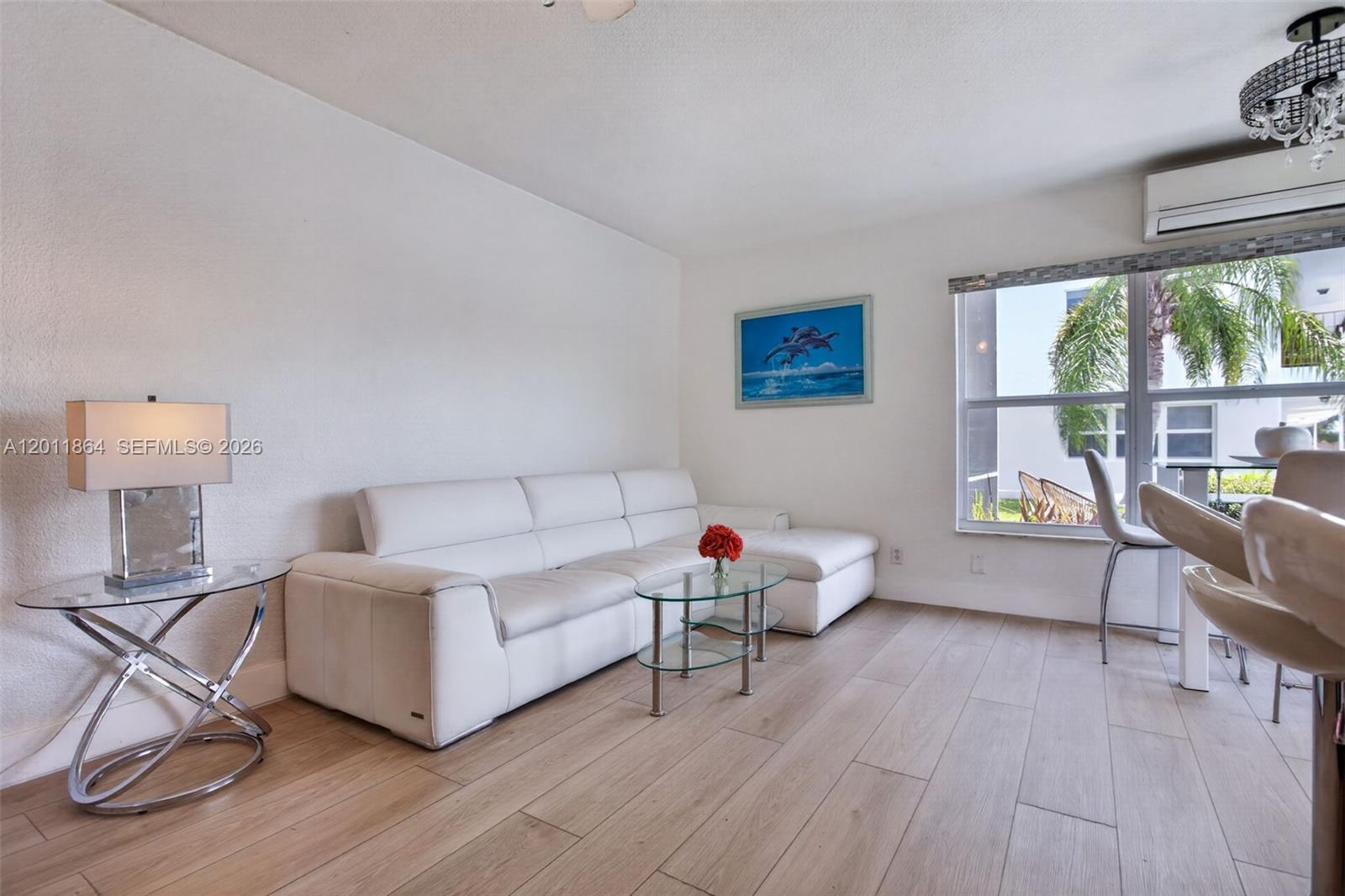615 South Riverside Drive, Unit 5 Pompano Beach, FL 33062 - Photo 8 of 29 a living room with furniture and a large window