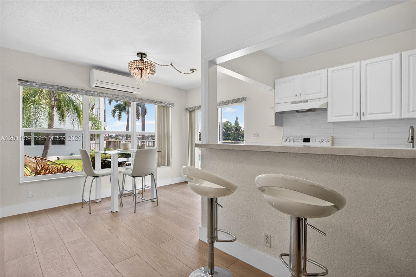 615 South Riverside Drive, Unit 5 Pompano Beach, FL 33062 - Photo 9 of 29 a kitchen with stainless steel appliances granite countertop a sink and cabinets