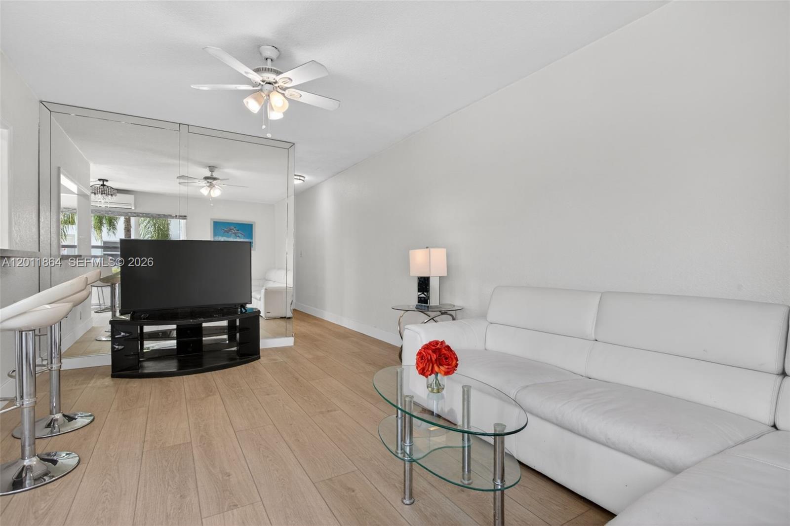 615 South Riverside Drive, Unit 5 Pompano Beach, FL 33062 - Photo 10 of 29 a living room with furniture and a flat screen tv