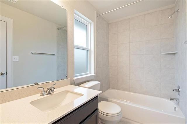 113 Gaida Loop Georgetown, TX 78628 - Photo 19 of 23 Full bathroom with vanity and bathtub / shower combination