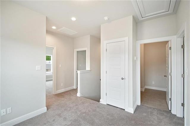 113 Gaida Loop Georgetown, TX 78628 - Photo 22 of 23 Unfurnished bedroom featuring light carpet and recessed lighting