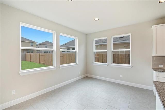 113 Gaida Loop Georgetown, TX 78628 - Photo 8 of 23 Unfurnished dining area with recessed lighting and light tile patterned floors