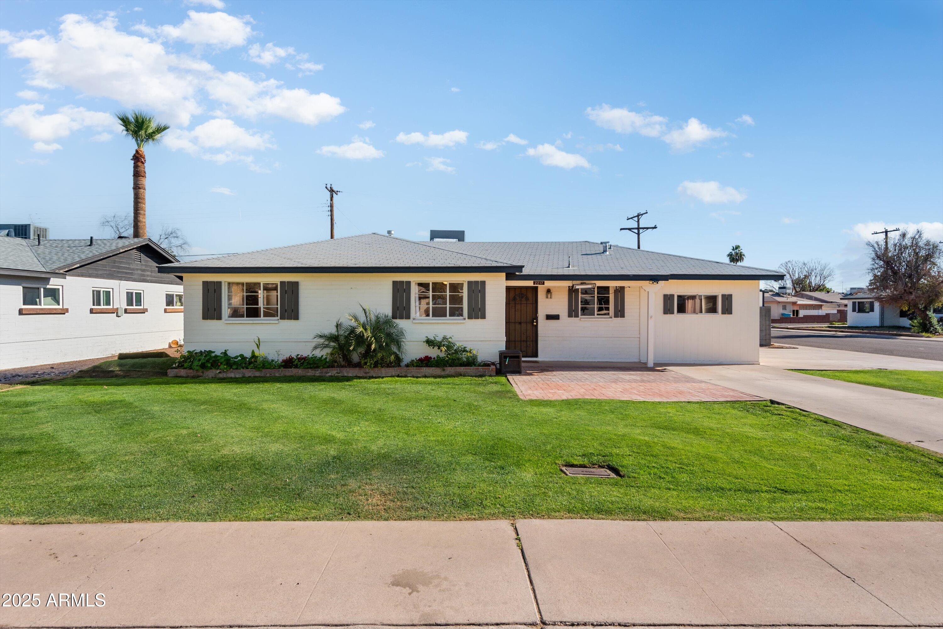2217 West Gardenia Drive Phoenix, AZ 85021 - Photo 1 of 32 front view of a house with a patio