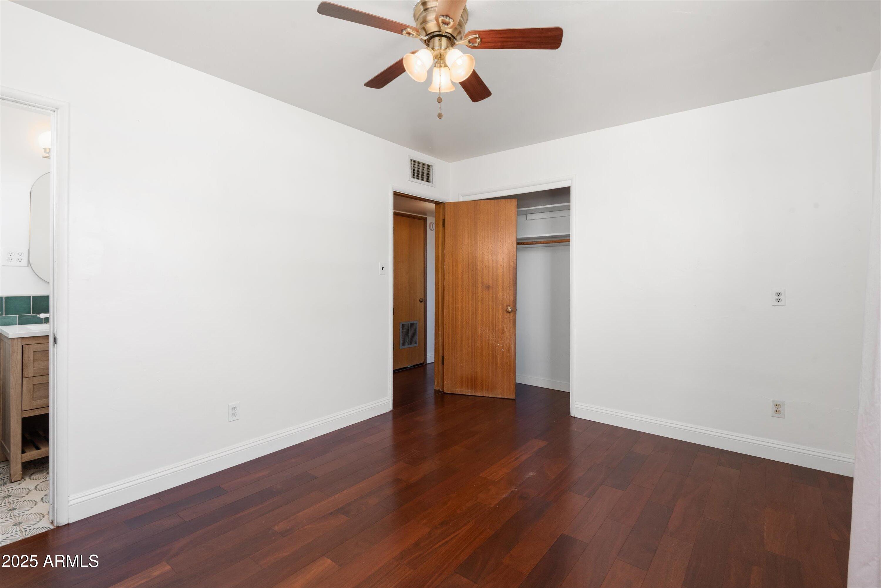 2217 West Gardenia Drive Phoenix, AZ 85021 - Photo 13 of 32 wooden floor in an empty room