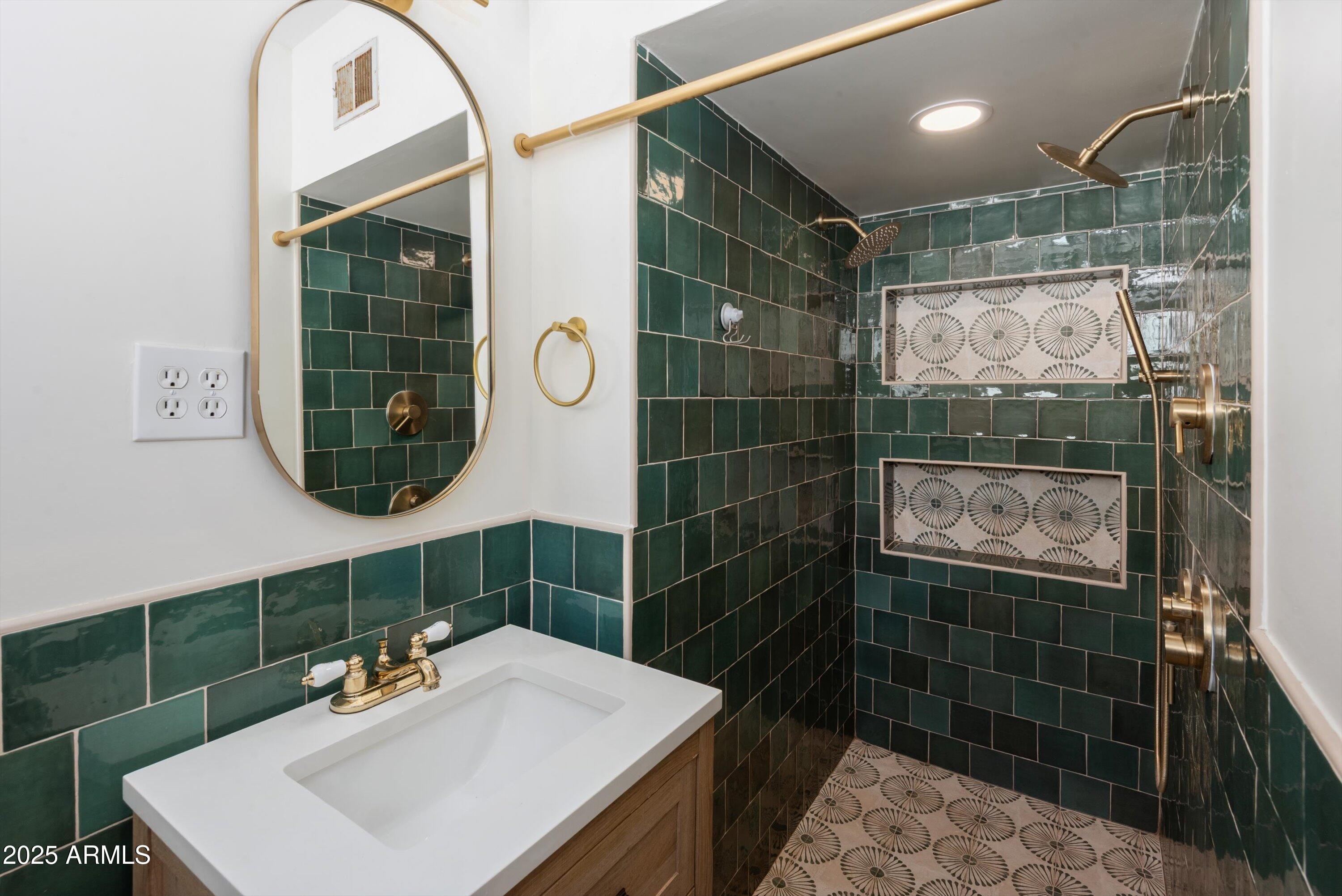 2217 West Gardenia Drive Phoenix, AZ 85021 - Photo 16 of 32 a bathroom with a sink a shower and a mirror