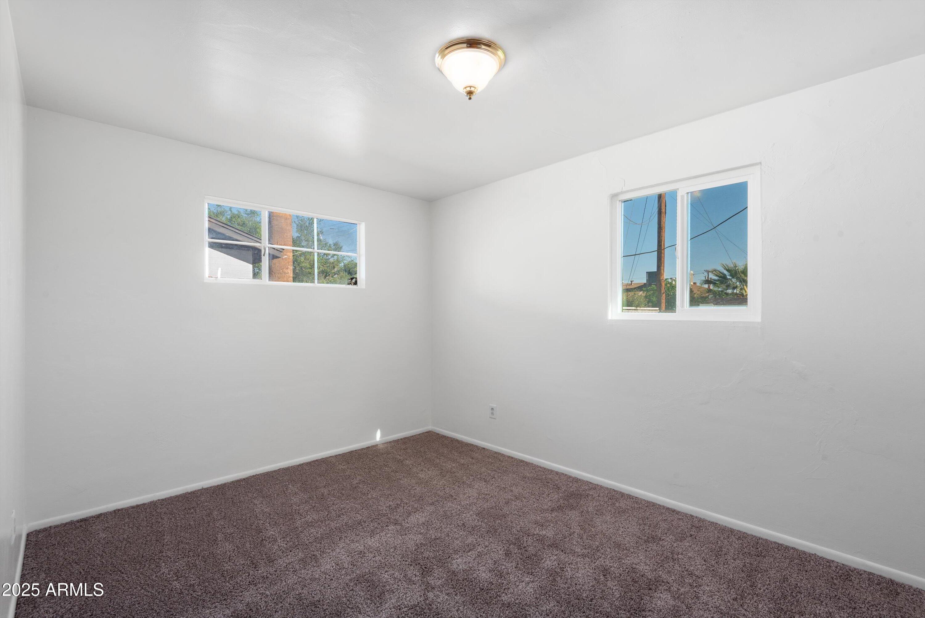 2217 West Gardenia Drive Phoenix, AZ 85021 - Photo 17 of 32 an empty room with a window