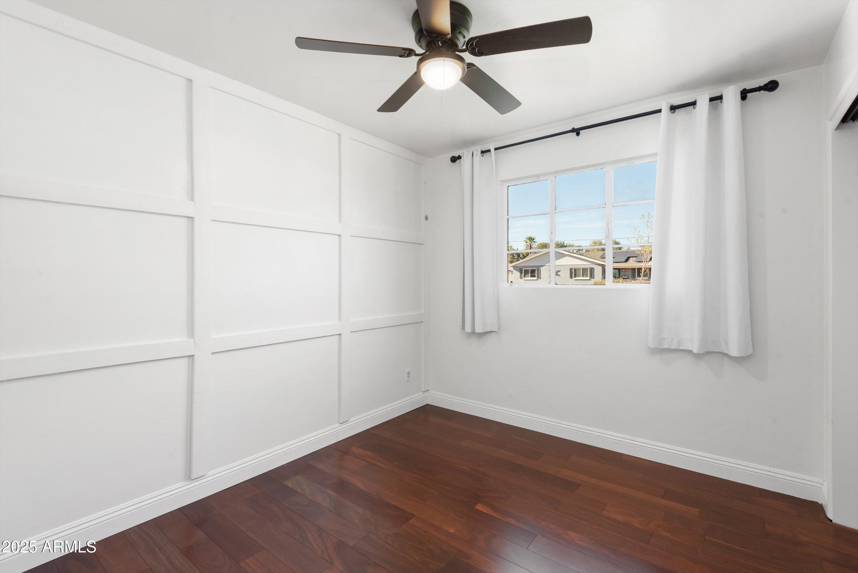 2217 West Gardenia Drive Phoenix, AZ 85021 - Photo 20 of 32 a view of a room with wooden floor and white walls
