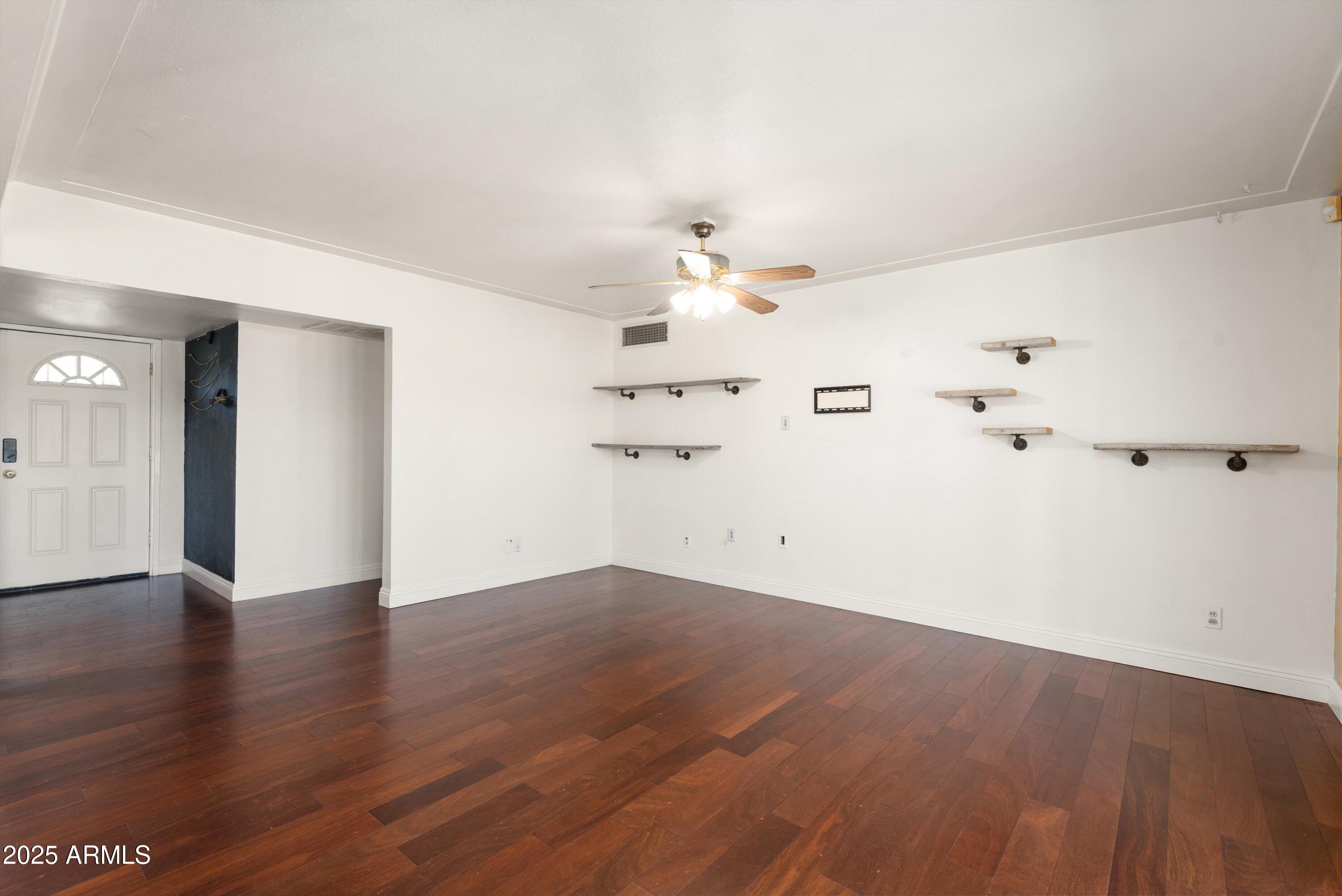2217 West Gardenia Drive Phoenix, AZ 85021 - Photo 4 of 32 wooden floor in an empty room