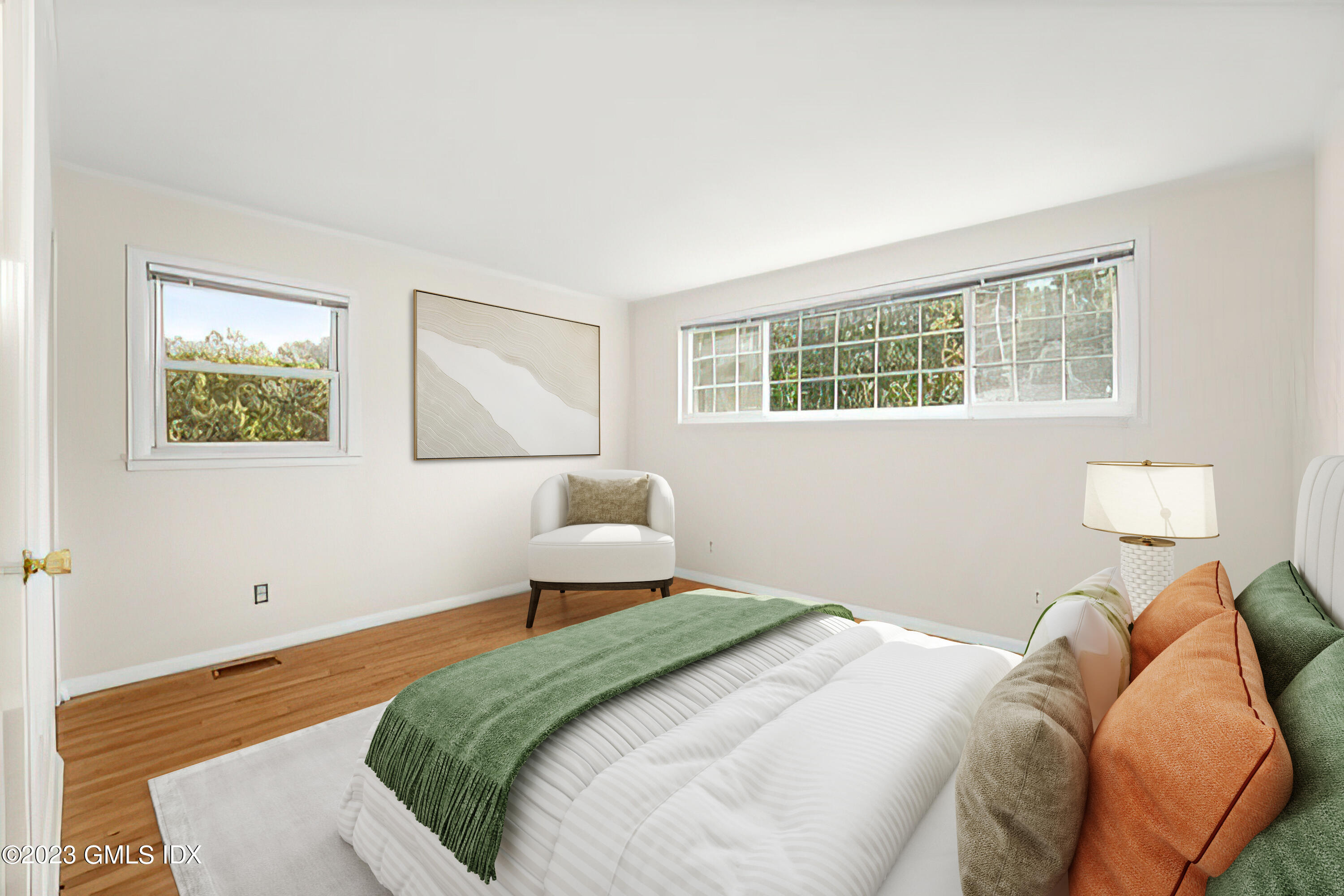 27 Silver Beech Road Riverside, CT 06878 - Photo 7 of 19 a bedroom with a bed and wooden floor