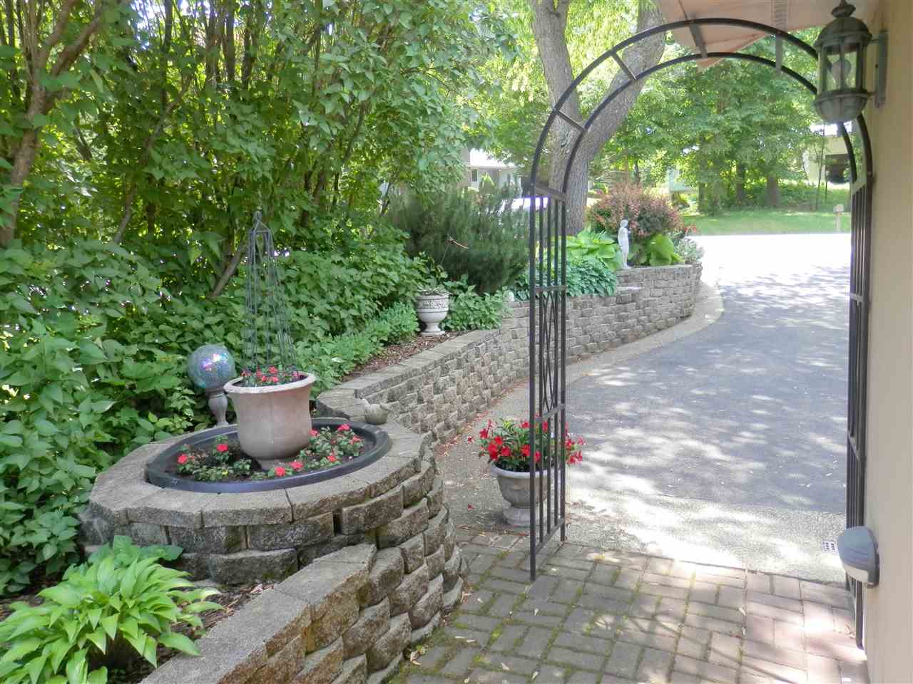 512 Baintree Road Lake Summerset, IL 61019 - Photo 11 of 25 a view of a backyard with plants and trees