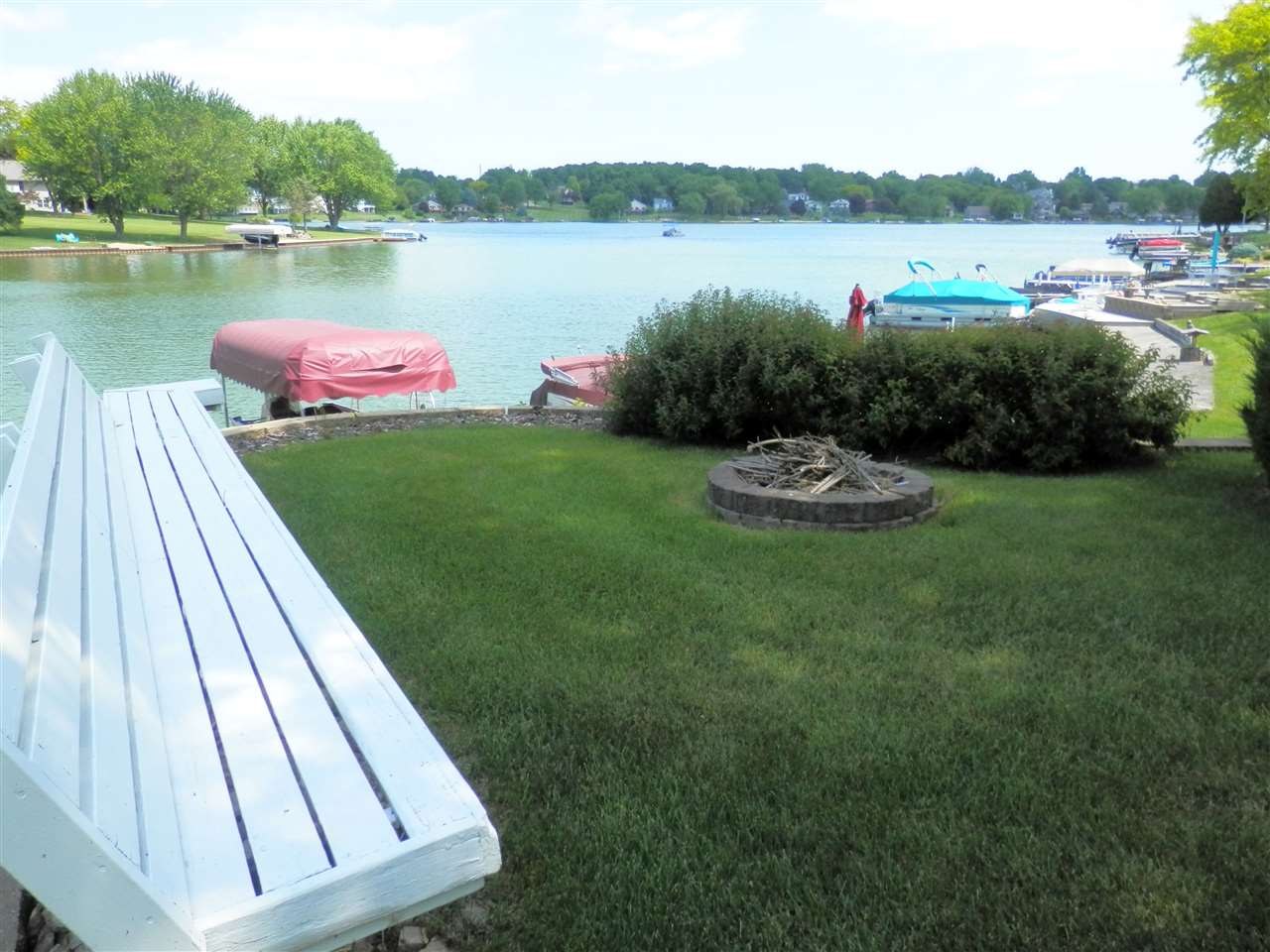 512 Baintree Road Lake Summerset, IL 61019 - Photo 5 of 25 a backyard of a house with outdoor seating and lake view