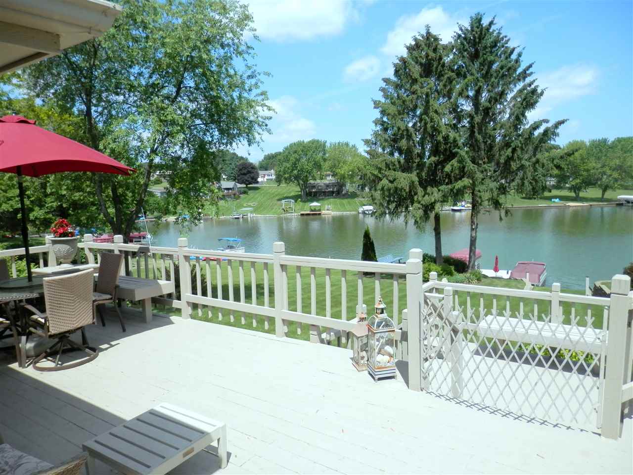 512 Baintree Road Lake Summerset, IL 61019 - Photo 8 of 25 a view of a deck with chair and table under an umbrella