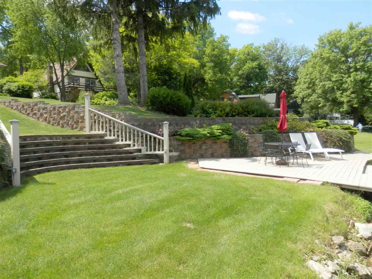 512 Baintree Road Lake Summerset, IL 61019 - Photo 9 of 25 a view of house with swimming pool and garden
