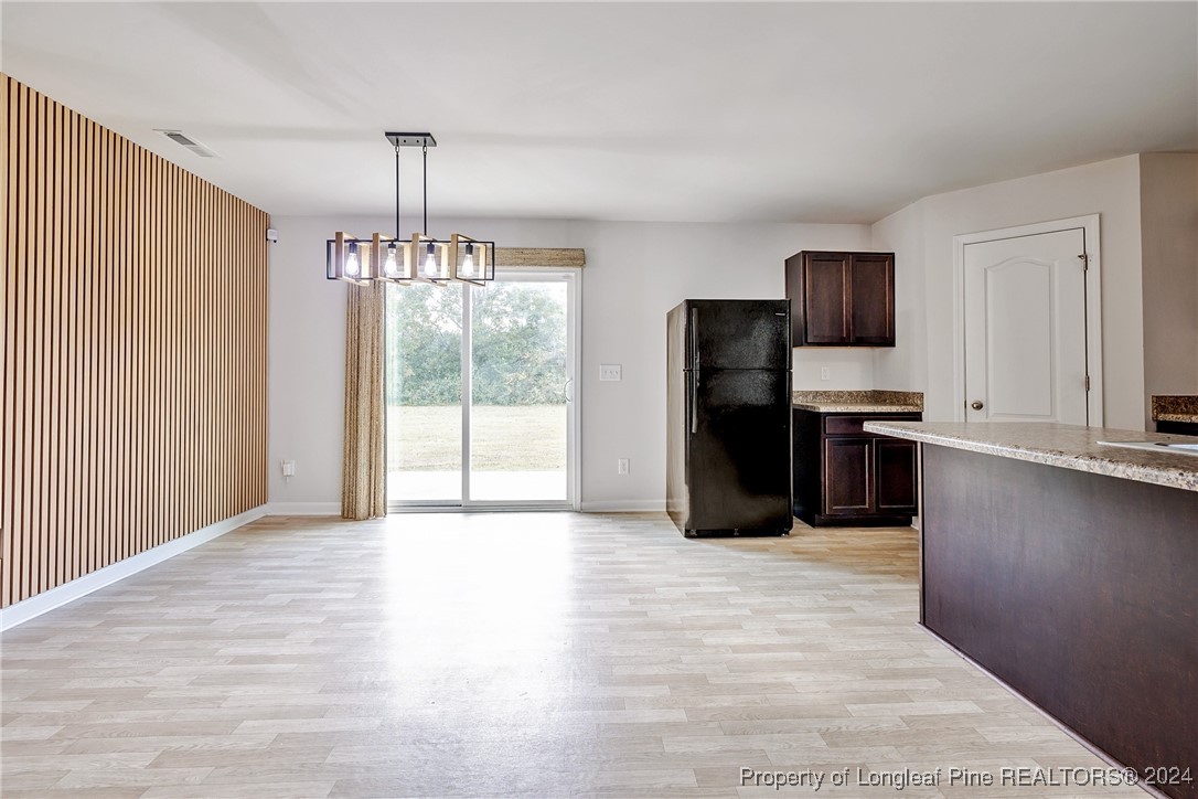 5918 Lowgrass Road Stedman, NC 28391 - Photo 11 of 32 a view of a kitchen with a sink and refrigerator