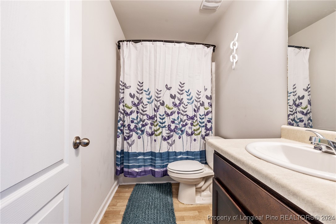 5918 Lowgrass Road Stedman, NC 28391 - Photo 13 of 32 a bathroom with a sink toilet and shower