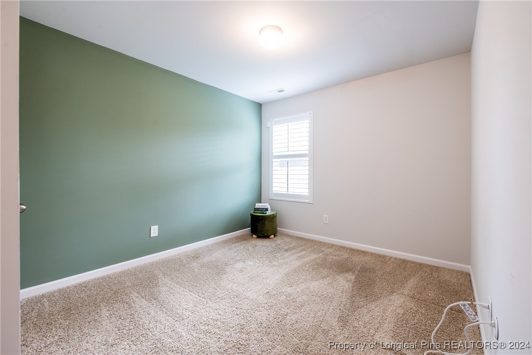 5918 Lowgrass Road Stedman, NC 28391 - Photo 14 of 32 an empty room with windows