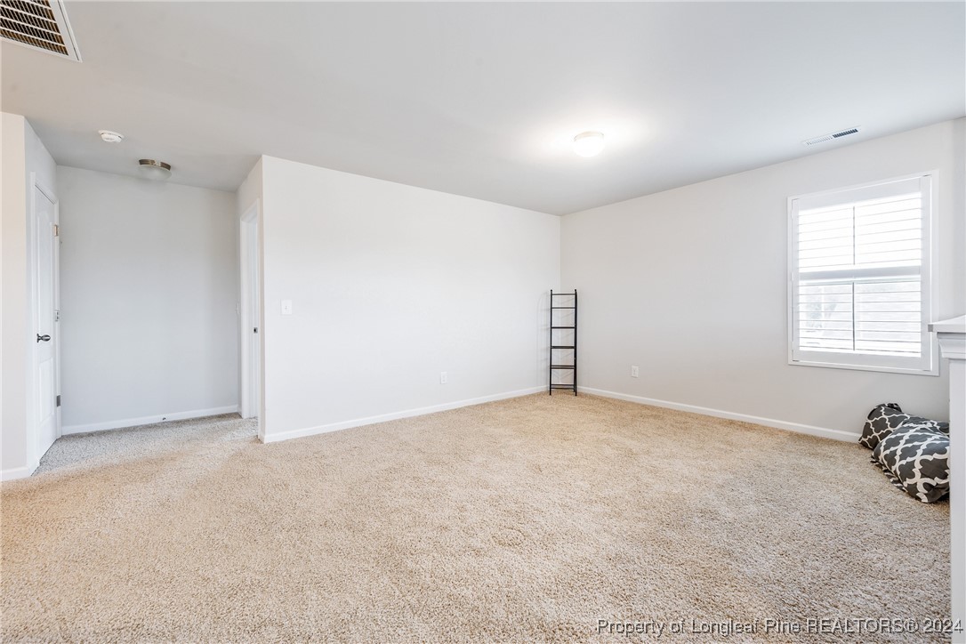 5918 Lowgrass Road Stedman, NC 28391 - Photo 17 of 32 a view of an empty room with a window