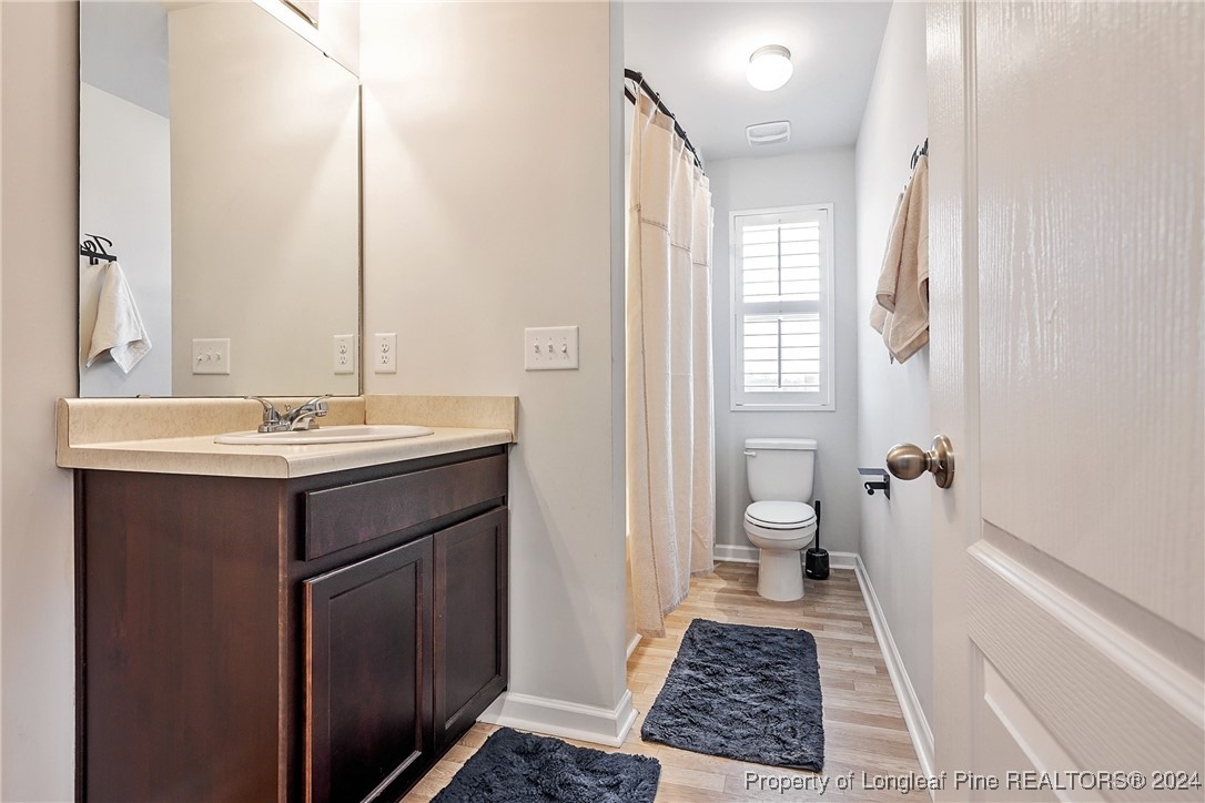 5918 Lowgrass Road Stedman, NC 28391 - Photo 18 of 32 a bathroom with a sink and a mirror