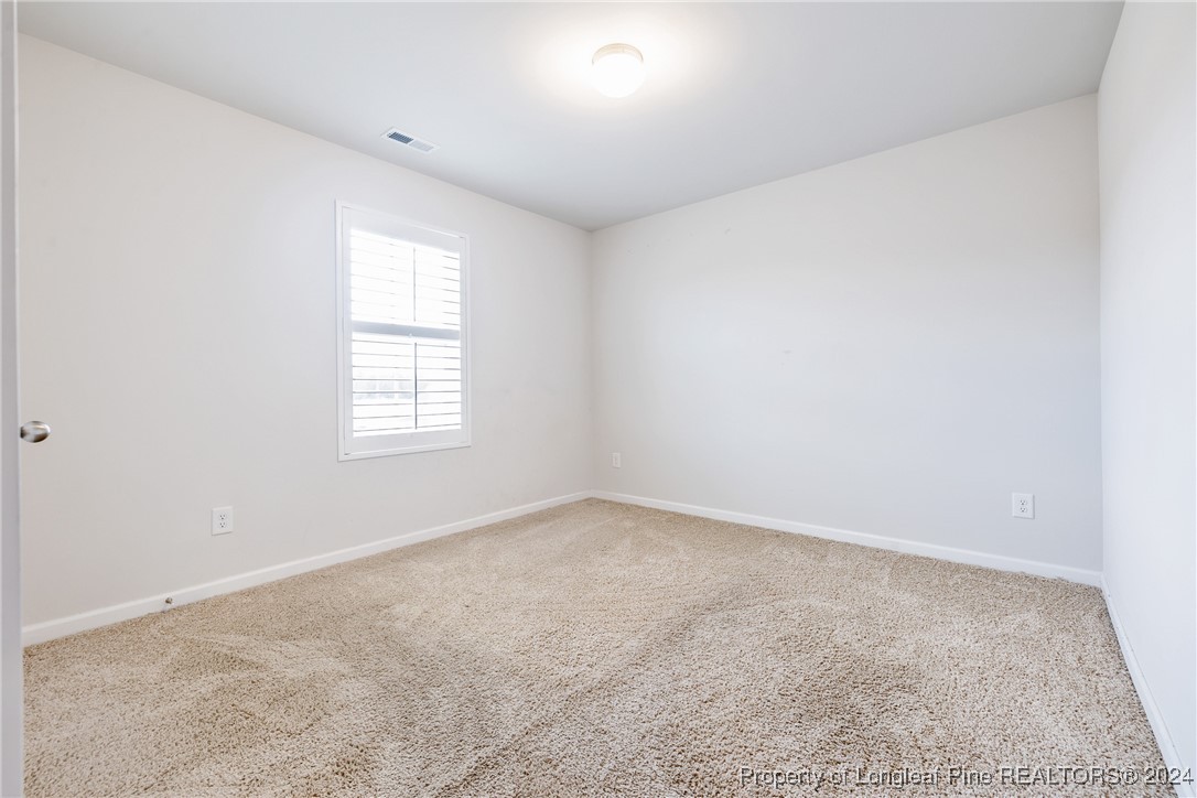 5918 Lowgrass Road Stedman, NC 28391 - Photo 19 of 32 an empty room with a window