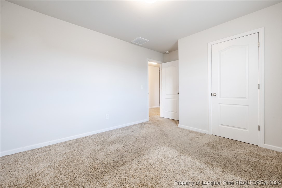 5918 Lowgrass Road Stedman, NC 28391 - Photo 20 of 32 an empty room with an entryway