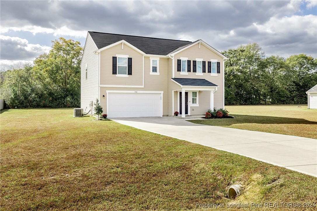 5918 Lowgrass Road Stedman, NC 28391 - Photo 2 of 32 a front view of a house with a yard