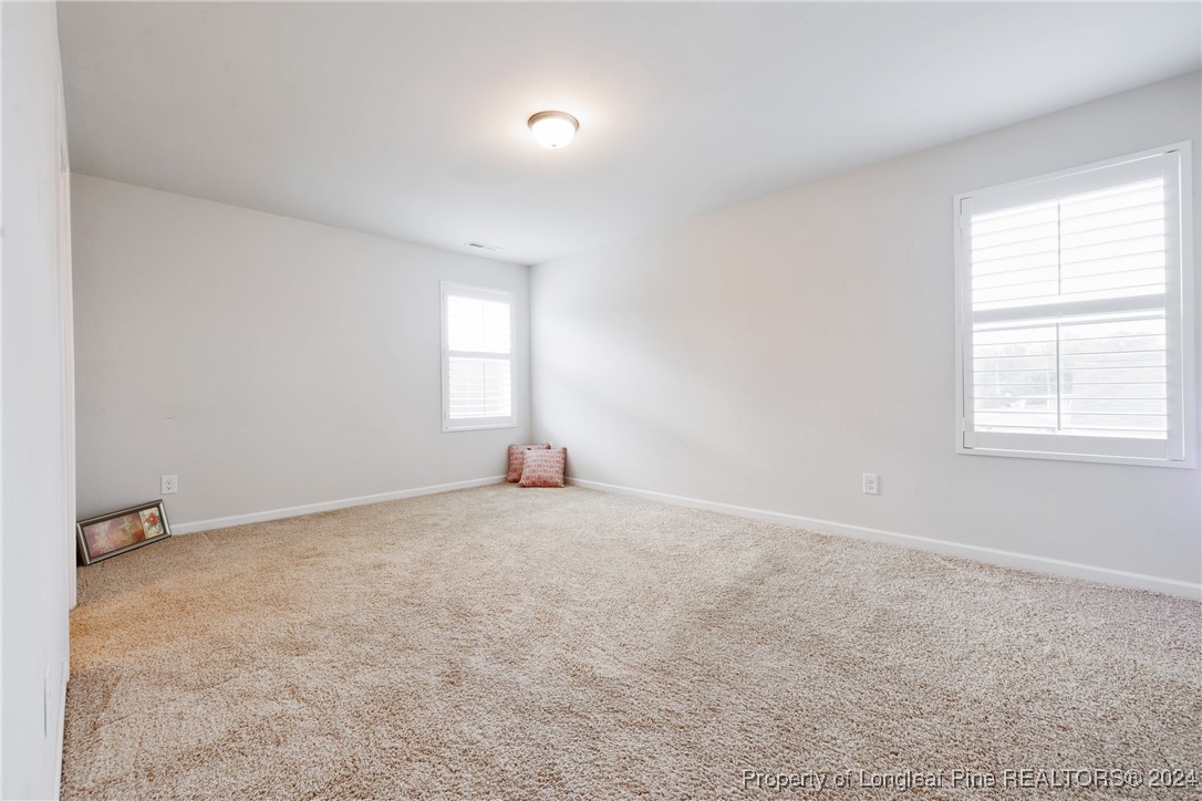 5918 Lowgrass Road Stedman, NC 28391 - Photo 24 of 32 an empty room with windows and closet