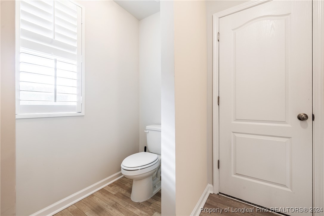 5918 Lowgrass Road Stedman, NC 28391 - Photo 28 of 32 a white toilet sitting next to a window