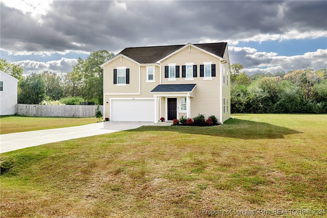 5918 Lowgrass Road Stedman, NC 28391 - Photo 3 of 32 a front view of a house with a yard