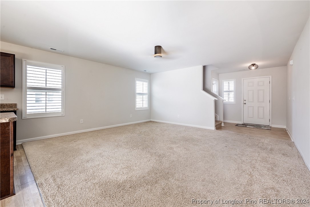 5918 Lowgrass Road Stedman, NC 28391 - Photo 7 of 32 an empty room with windows