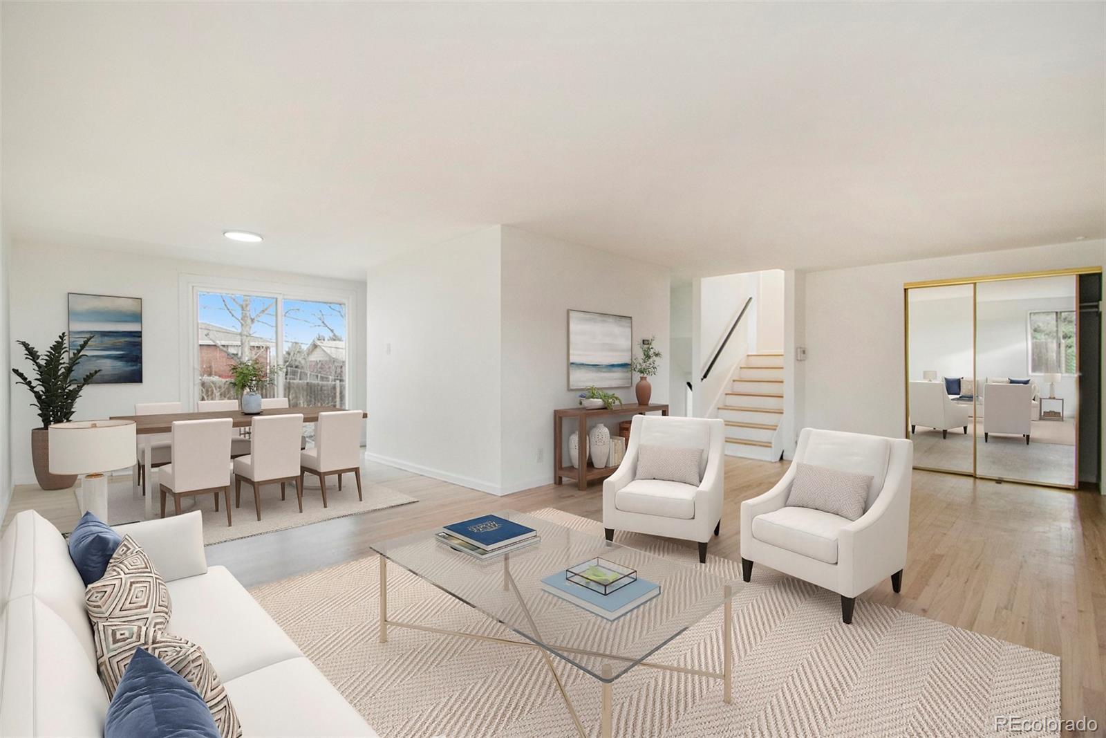 8360 Emerson Street Denver, CO 80229 - Photo 1 of 13 a living room with furniture and wooden floor