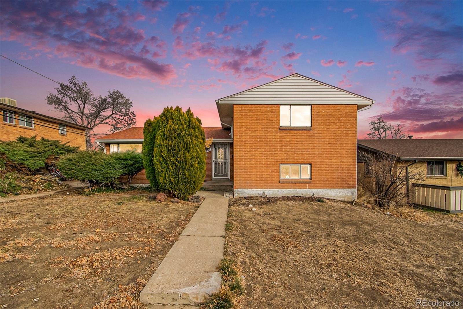 8360 Emerson Street Denver, CO 80229 - Photo 2 of 13 a front view of a house with a yard