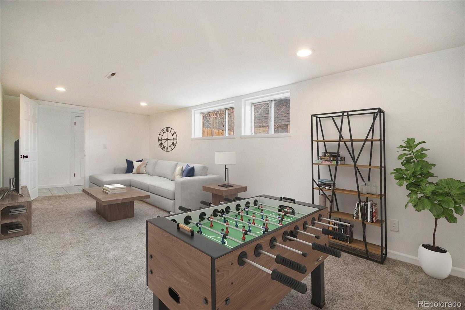 8360 Emerson Street Denver, CO 80229 - Photo 6 of 13 a living room with furniture and a potted plant