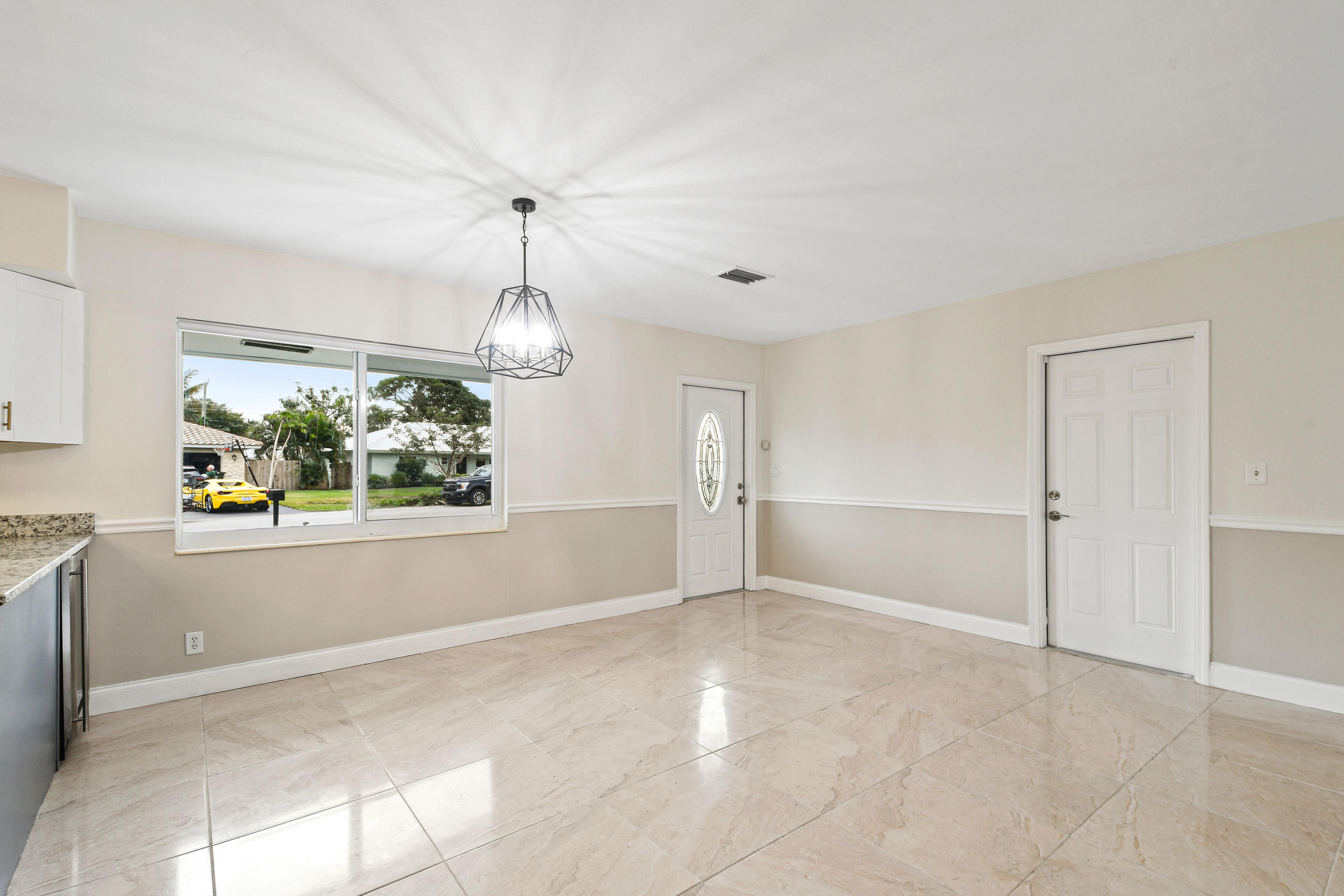 2003 Park Place Boca Raton, FL 33486 - Photo 10 of 42 an empty room with windows and outdoor view