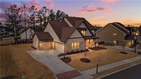 a view of a house with backyard porch and sitting area