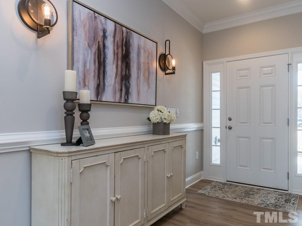 104 Red Cardinal Way Angier, NC 27501 - Photo 3 of 26 a bathroom with a sink and a mirror