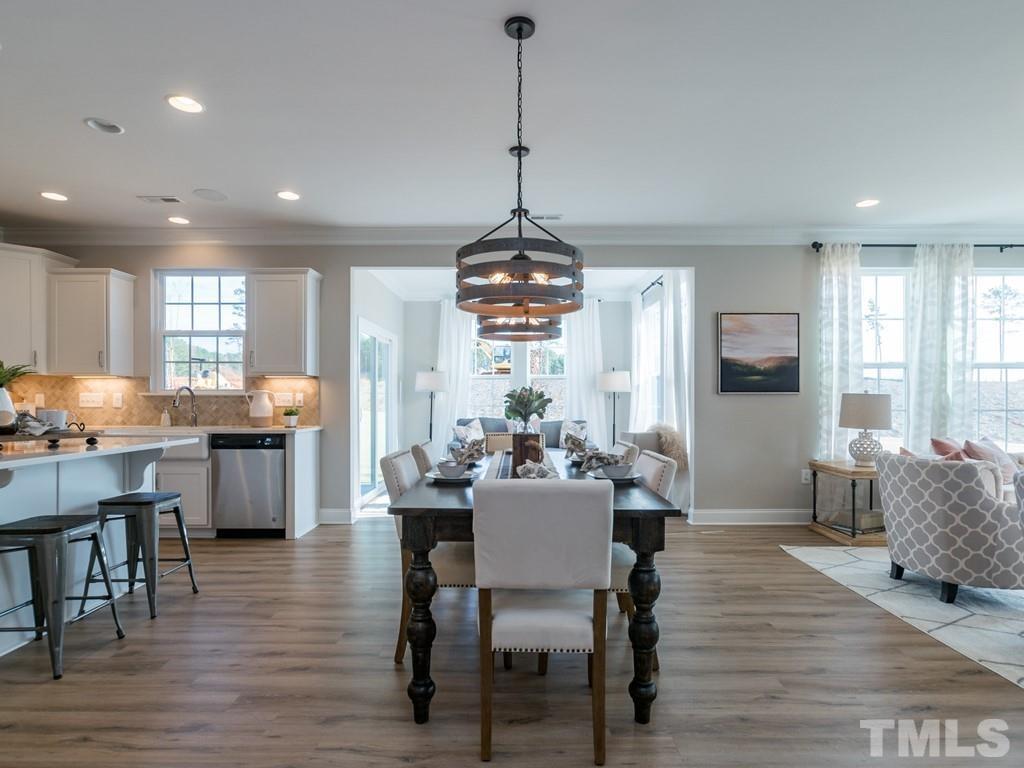 104 Red Cardinal Way Angier, NC 27501 - Photo 5 of 26 a dining room with furniture window wooden floor