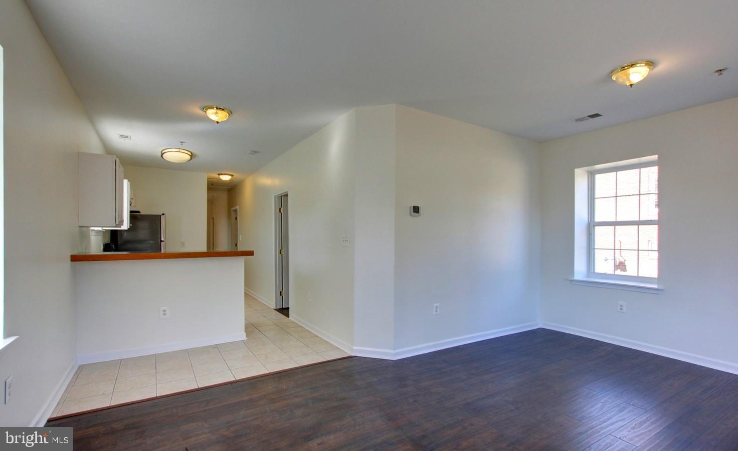 4813 Calvert Road College Park, MD 20740 - Photo 9 of 28 Living room with view of kitchen