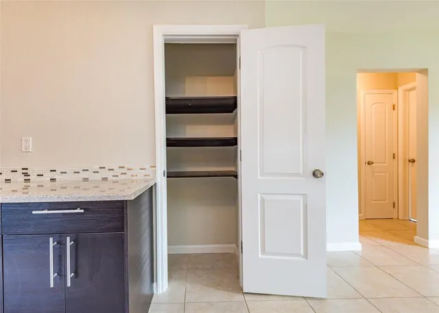a view of a kitchen from the hallway