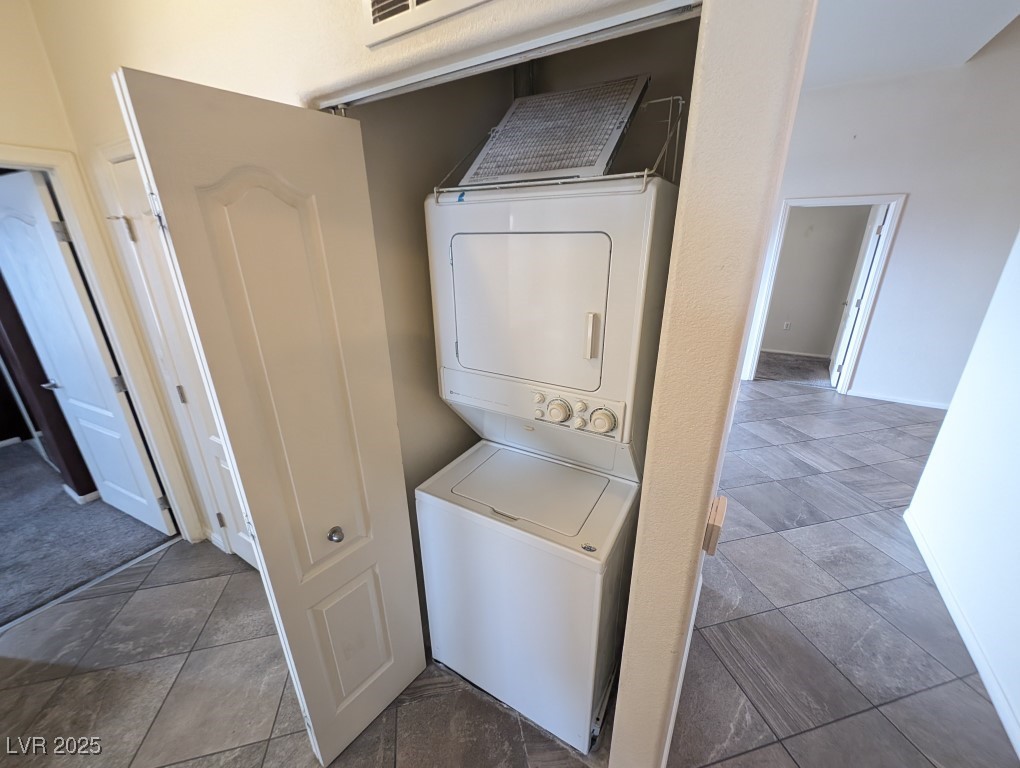 3504 Desert Cliff Street, Unit 203 Las Vegas, NV 89129 - Photo 16 of 20 Laundry area with stacked washing machine and dryer