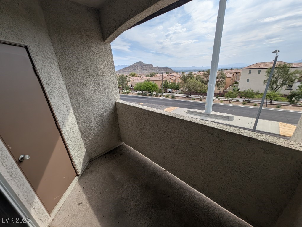 3504 Desert Cliff Street, Unit 203 Las Vegas, NV 89129 - Photo 17 of 20 Balcony with a mountain view and a residential view