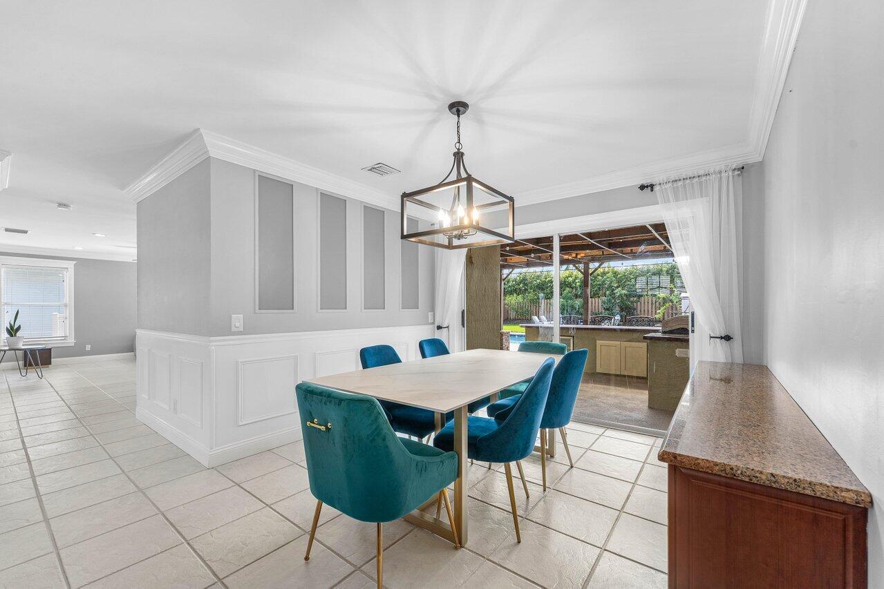 9434 Fox Trot Lane Boca Raton, FL 33496 - Photo 11 of 66 a view of a dining room with furniture window and outside view