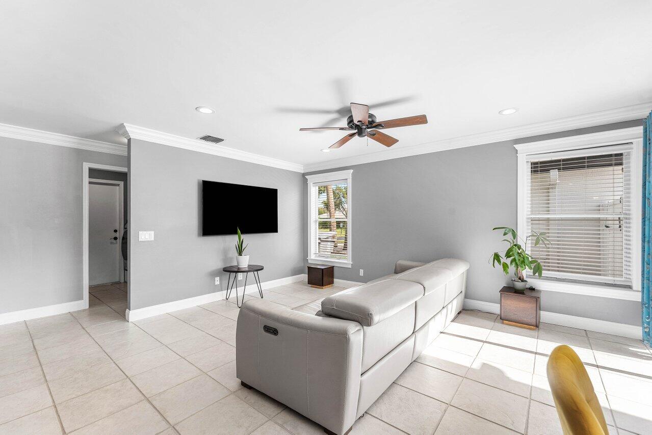 9434 Fox Trot Lane Boca Raton, FL 33496 - Photo 18 of 66 a living room with furniture and a flat screen tv