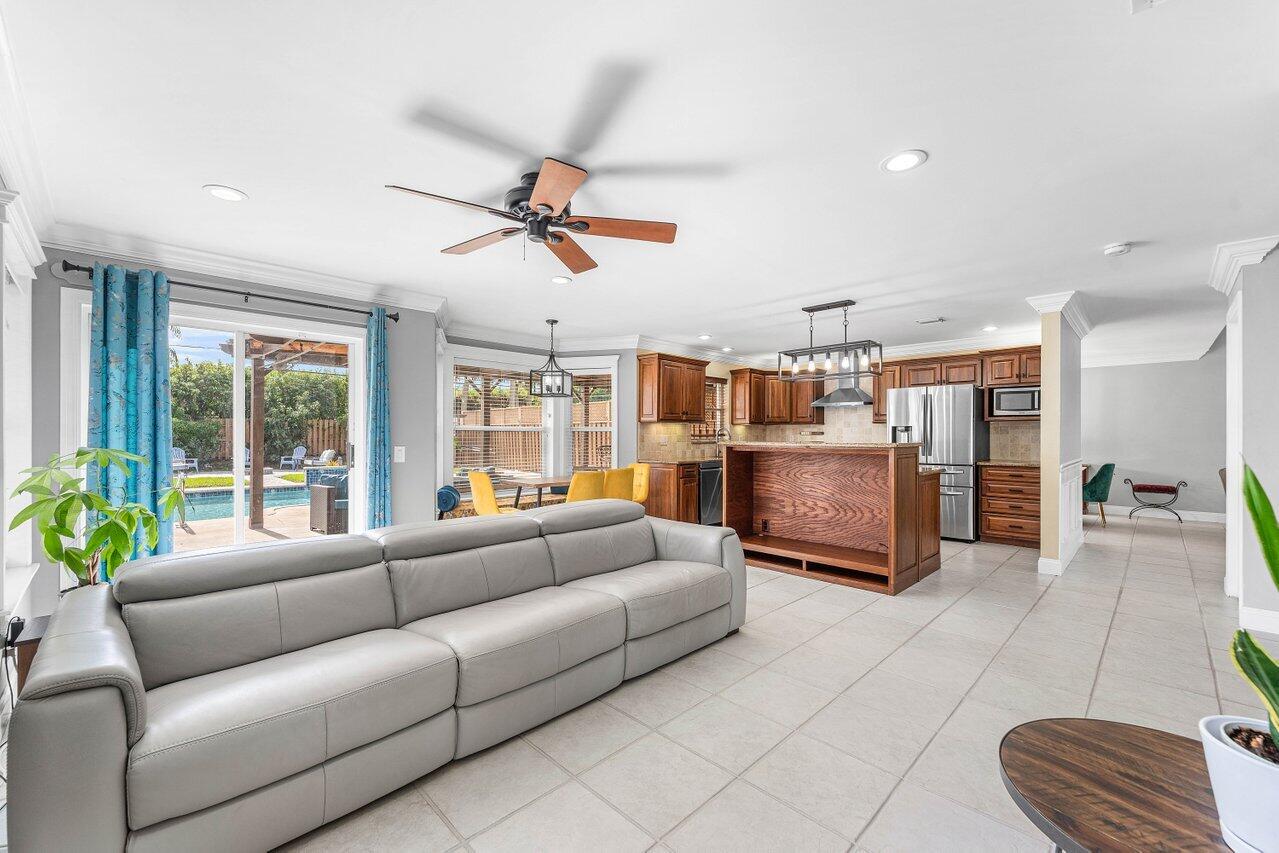 9434 Fox Trot Lane Boca Raton, FL 33496 - Photo 20 of 66 a living room with furniture and a large window