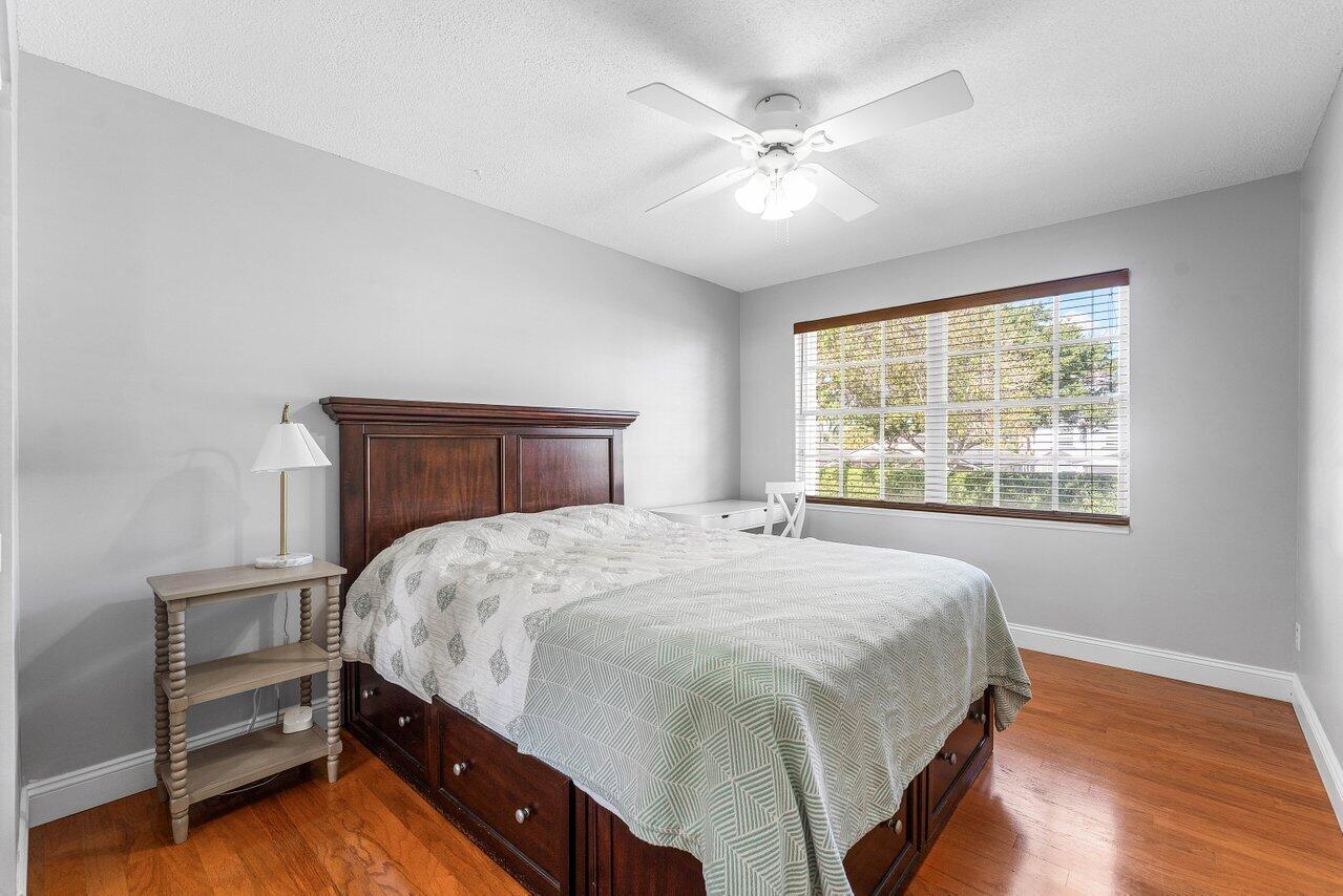 9434 Fox Trot Lane Boca Raton, FL 33496 - Photo 25 of 66 a bedroom with a bed and a window