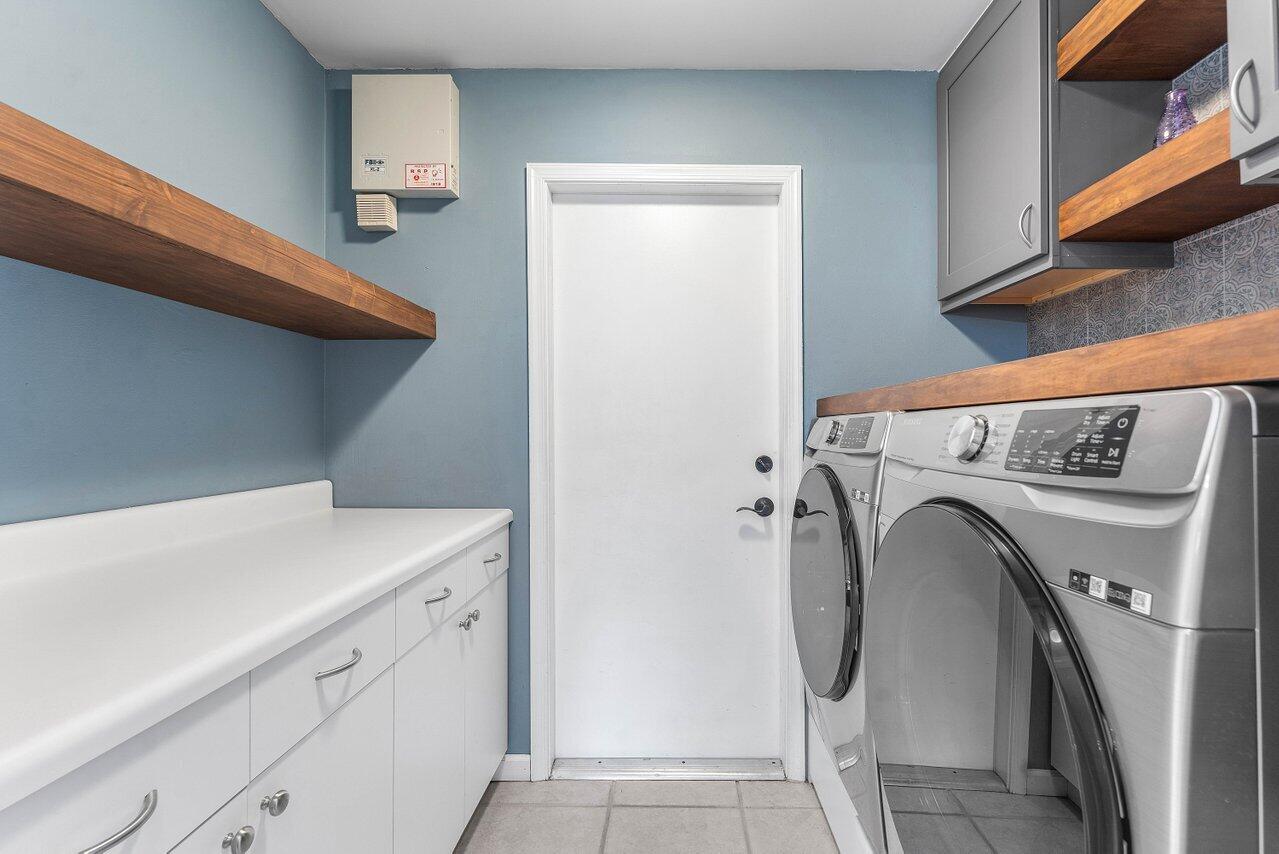 9434 Fox Trot Lane Boca Raton, FL 33496 - Photo 28 of 66 a utility room with dryer and washer
