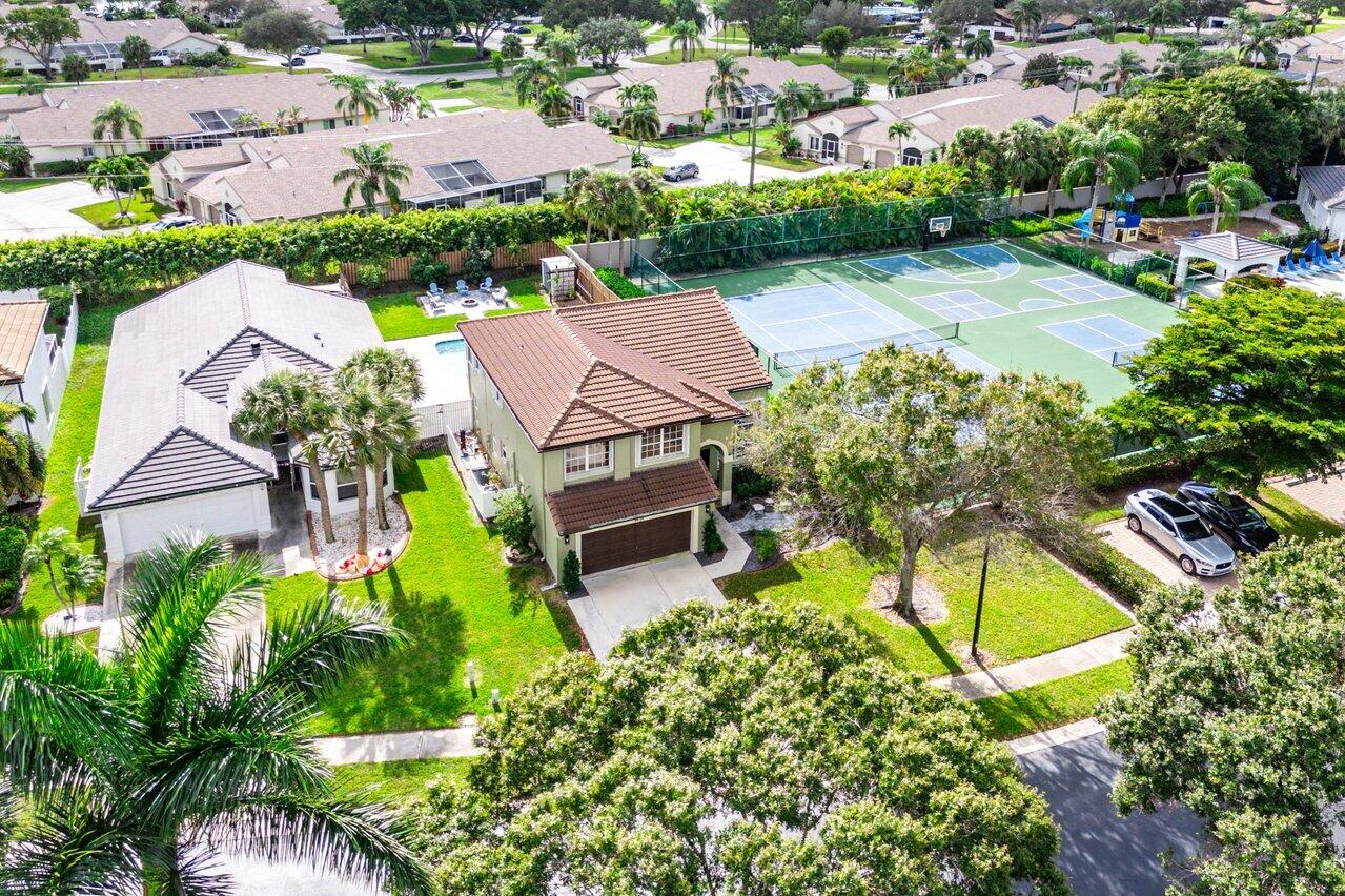9434 Fox Trot Lane Boca Raton, FL 33496 - Photo 41 of 66 an aerial view of a house with a swimming pool yard and outdoor seating