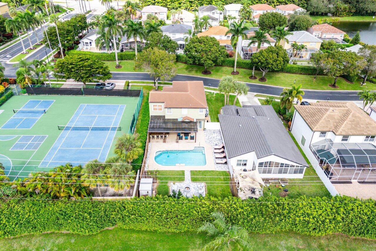 9434 Fox Trot Lane Boca Raton, FL 33496 - Photo 42 of 66 an aerial view of a house with garden space and street view